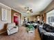 Spacious living room features an open layout with tile floors, comfortable seating, and backyard views at 25545 Laurel Valley Rd, Leesburg, FL 34748