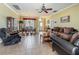 Inviting living room featuring tile floors, neutral paint, and comfortable seating at 25545 Laurel Valley Rd, Leesburg, FL 34748