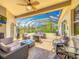 Enclosed patio area with comfortable seating, ceiling fan, and views of the outdoor landscape at 25545 Laurel Valley Rd, Leesburg, FL 34748