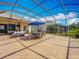 Enclosed patio featuring ample seating, a dining area, and views of the surrounding neighborhood at 25545 Laurel Valley Rd, Leesburg, FL 34748