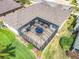 Aerial view of a home showcasing a spacious screened patio with outdoor seating, perfect for relaxing or entertaining at 25545 Laurel Valley Rd, Leesburg, FL 34748