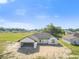 Aerial view capturing a modern residence with a two-car garage, set in a picturesque residential area at 2581 Se 75Th Blvd, Bushnell, FL 33513