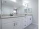 Bright bathroom features a double granite vanity, matte black hardware, and modern fixtures at 2581 Se 75Th Blvd, Bushnell, FL 33513