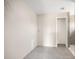 A bathroom featuring gray tile flooring, neutral-colored walls, and a doorway leading to the shower area at 2581 Se 75Th Blvd, Bushnell, FL 33513