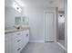 Bright bathroom features a double granite vanity, matte black hardware, and tiled walk-in shower at 2581 Se 75Th Blvd, Bushnell, FL 33513