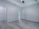 Open bedroom with tray ceilings, fan, and closet at 2581 Se 75Th Blvd, Bushnell, FL 33513