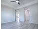 Open bedroom with tray ceilings, fan, and plenty of natural light at 2581 Se 75Th Blvd, Bushnell, FL 33513