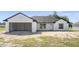 Charming single-story home with a two-car garage and well-lit with natural light from the windows at 2581 Se 75Th Blvd, Bushnell, FL 33513