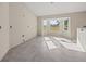 Bright living room featuring tile floors and a large bay window offering ample natural light at 2581 Se 75Th Blvd, Bushnell, FL 33513