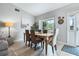 Bright dining area with new floors, a dining table with seating for four at 25818 Belle Alliance, Leesburg, FL 34748