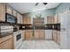 Functional kitchen with sleek countertops and updated appliances, offering a practical space for cooking and entertaining at 25818 Belle Alliance, Leesburg, FL 34748