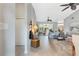 Spacious living room with gray walls, new floors, fan, and open sight lines at 25818 Belle Alliance, Leesburg, FL 34748