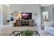 Cozy living room with tv, side table, a guitar, and decor at 25818 Belle Alliance, Leesburg, FL 34748