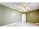 Bedroom showcasing tile floors, neutral walls, and a closet at 26823 Forest Hills St, Leesburg, FL 34788