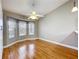 Spacious bedroom features beautiful hardwood floors, a ceiling fan and a bay window letting in lots of natural light at 26823 Forest Hills St, Leesburg, FL 34788