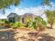 A well-maintained home with a screened porch and lush landscaping enhancing the outdoor living space at 26823 Forest Hills St, Leesburg, FL 34788