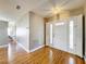 Inviting foyer with wood-look flooring and decorative front door with sidelights at 26823 Forest Hills St, Leesburg, FL 34788