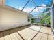 A screened-in patio provides an outdoor space, featuring tile flooring and attached to the home's exterior at 26823 Forest Hills St, Leesburg, FL 34788