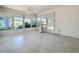Sunroom with tile flooring, wall to wall windows, and plenty of natural light at 26823 Forest Hills St, Leesburg, FL 34788