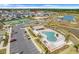 Aerial view of the community with pool, parking, and recreational facilities with easy access from surrounding homes at 2775 Navy Hill Cir, The Villages, FL 32163
