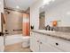 Bathroom featuring granite countertop vanity and a shower with a tub at 2775 Navy Hill Cir, The Villages, FL 32163