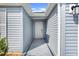 Inviting entrance with a covered walkway leading to a pristine white front door at 2775 Navy Hill Cir, The Villages, FL 32163
