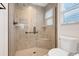 Modern shower featuring grey tiles, glass enclosure, and matte black fixtures at 2775 Navy Hill Cir, The Villages, FL 32163
