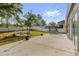 Private backyard has a stone fire pit and grassy yard at 2988 Santa Maria Ave, Clermont, FL 34715