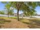 Spacious backyard has a fire pit, trampoline, and a tall privacy fence at 2988 Santa Maria Ave, Clermont, FL 34715
