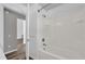 Modern bathroom featuring a shower and bath tub and hardwood style flooring at 2988 Santa Maria Ave, Clermont, FL 34715