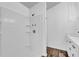 Bathroom featuring a shower and vanity with white cabinets and hardwood style flooring at 2988 Santa Maria Ave, Clermont, FL 34715