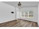 Bright bedroom featuring a window, hardwood style flooring, and white painted walls at 2988 Santa Maria Ave, Clermont, FL 34715