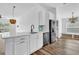 Kitchen featuring a large island, white countertops, and stainless steel appliances at 2988 Santa Maria Ave, Clermont, FL 34715