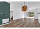 Spacious living room with hardwood floors, decorative lighting, and sliding glass doors to the patio at 2988 Santa Maria Ave, Clermont, FL 34715