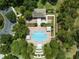Aerial view of a community pool with ample seating and lush landscaping at 2988 Santa Maria Ave, Clermont, FL 34715