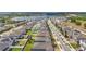 A bird's eye view of the neighborhood with lots of home and a lake in the distance at 3193 Hill Point St, Minneola, FL 34715