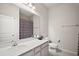 Clean bathroom featuring a vanity with sink, mirror, and shower with curtain at 3193 Hill Point St, Minneola, FL 34715