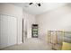 Bright bedroom with neutral walls, carpet, and a closet, offering a serene and adaptable living space at 3193 Hill Point St, Minneola, FL 34715