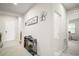 Hallway with a console table and decorative items, leading to other rooms at 3193 Hill Point St, Minneola, FL 34715