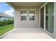 Covered patio with sliding glass doors, perfect for outdoor lounging and seamlessly connecting indoor and outdoor living at 3193 Hill Point St, Minneola, FL 34715