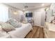 Charming bedroom with wood floors, decorated with playful floral accents and a modern ceiling fan for comfort at 3273 Dzuro Dr, Oxford, FL 34484