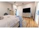 Bright bedroom with wood floors, neutral walls, ceiling fan and plenty of natural light at 3273 Dzuro Dr, Oxford, FL 34484