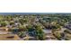 Panoramic aerial view of a charming residential area with tidy streets, mature trees, and access to a nearby lake at 36337 Terra Ct, Grand Island, FL 32735