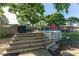 Above-ground pool with wooden deck, with ladder, pump, and a shed nearby, perfect for outdoor fun at 36337 Terra Ct, Grand Island, FL 32735
