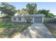 Inviting one-story house with a neat front yard, stylish siding, and an attached garage, perfect for comfortable living at 36337 Terra Ct, Grand Island, FL 32735