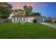 Charming single-story home with a lush green lawn and well-maintained landscaping at 36337 Terra Ct, Grand Island, FL 32735