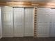 Hallway features sliding closet doors, wood beam accent, and neutral paint at 36337 Terra Ct, Grand Island, FL 32735