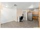 Spacious kitchen area with tile floors, stainless steel refrigerator, and wood cabinetry at 36337 Terra Ct, Grand Island, FL 32735
