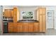 Well-lit kitchen featuring stainless steel appliances, granite countertops, and wood cabinets at 36337 Terra Ct, Grand Island, FL 32735
