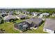 A home with screened-in pool is nestled in a beautiful community with lush green lawns at 3641 Arlington Ridge Blvd, Leesburg, FL 34748
